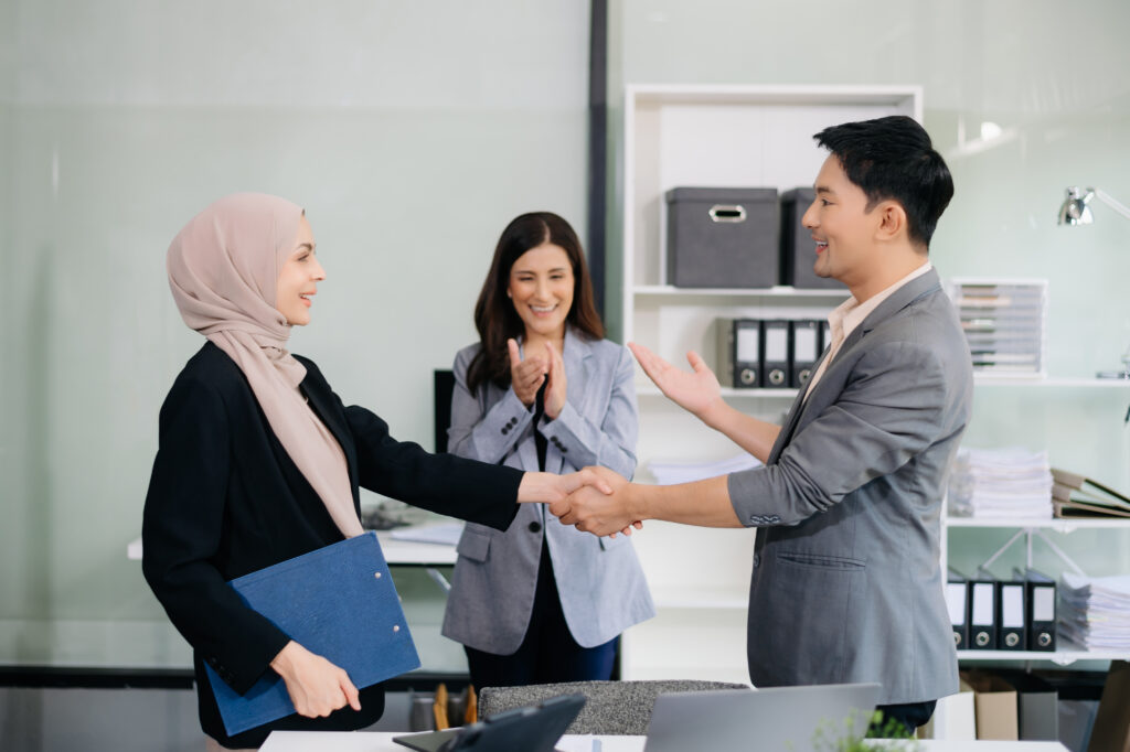 Business partnership handshake concept.Photo two coworkers handshaking process.Successful deal after great meeting.